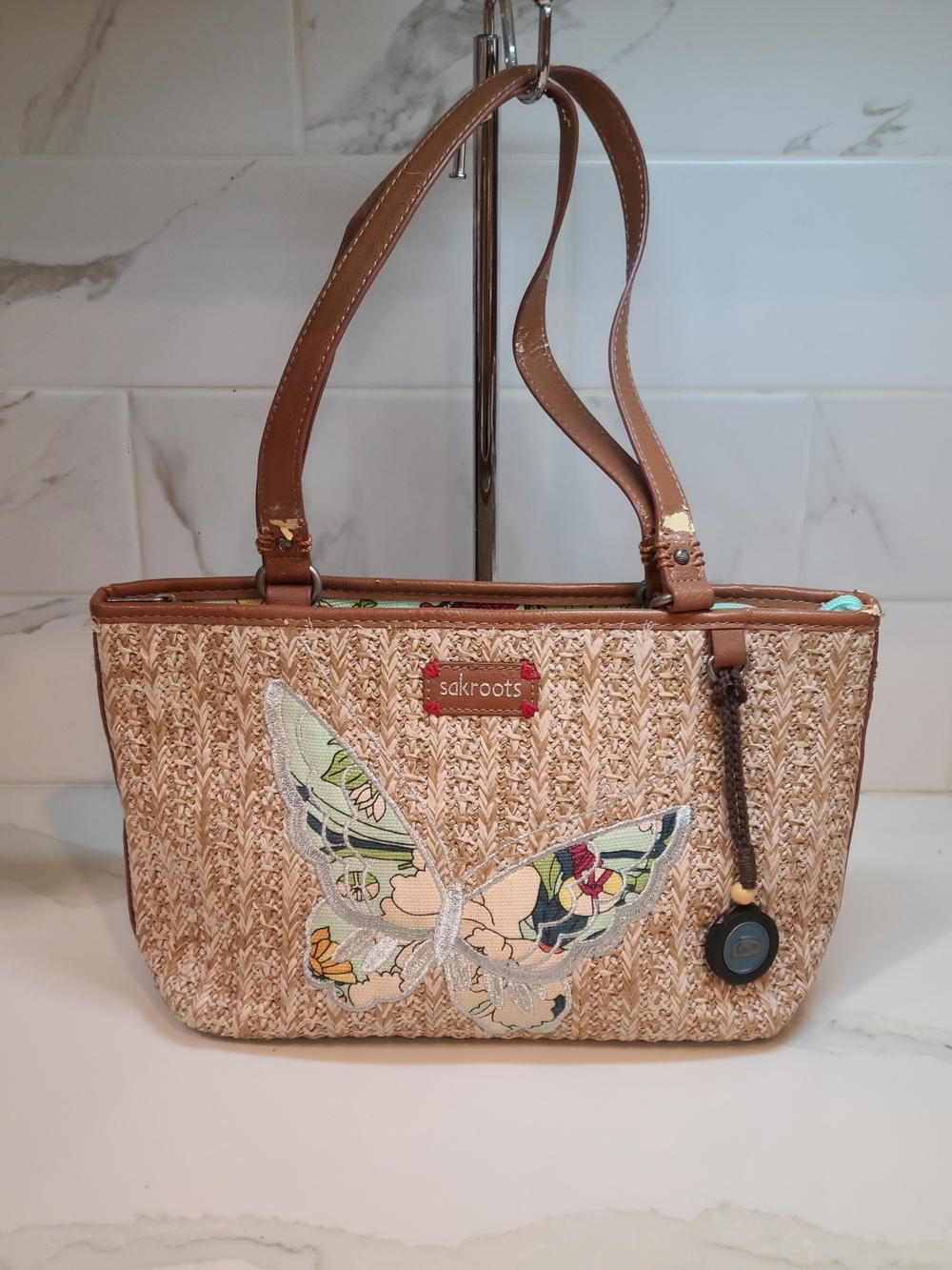 Sakroots Tan Woven Tote with Floral Butterfly Accent - Picture 1 of 13
